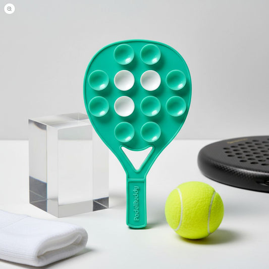 Mint Green PadelBuddy with bubble texture next to a yellow tennis ball on a white surface.